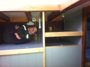 Timmy testing a double berth (no cushions yet)